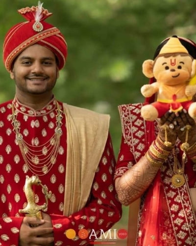 couple holding hanuman plush